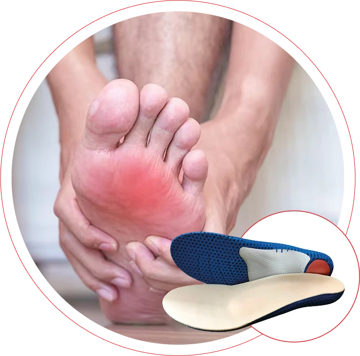 a foot with a red spot at the bottom and hands surrounding the foot